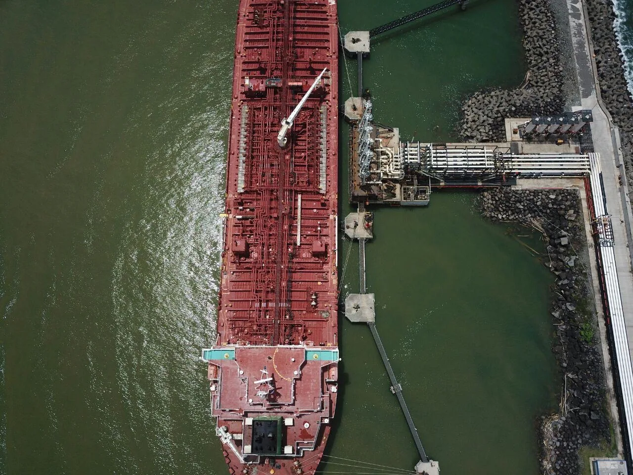 Cargo ship at sea with ocean horizon